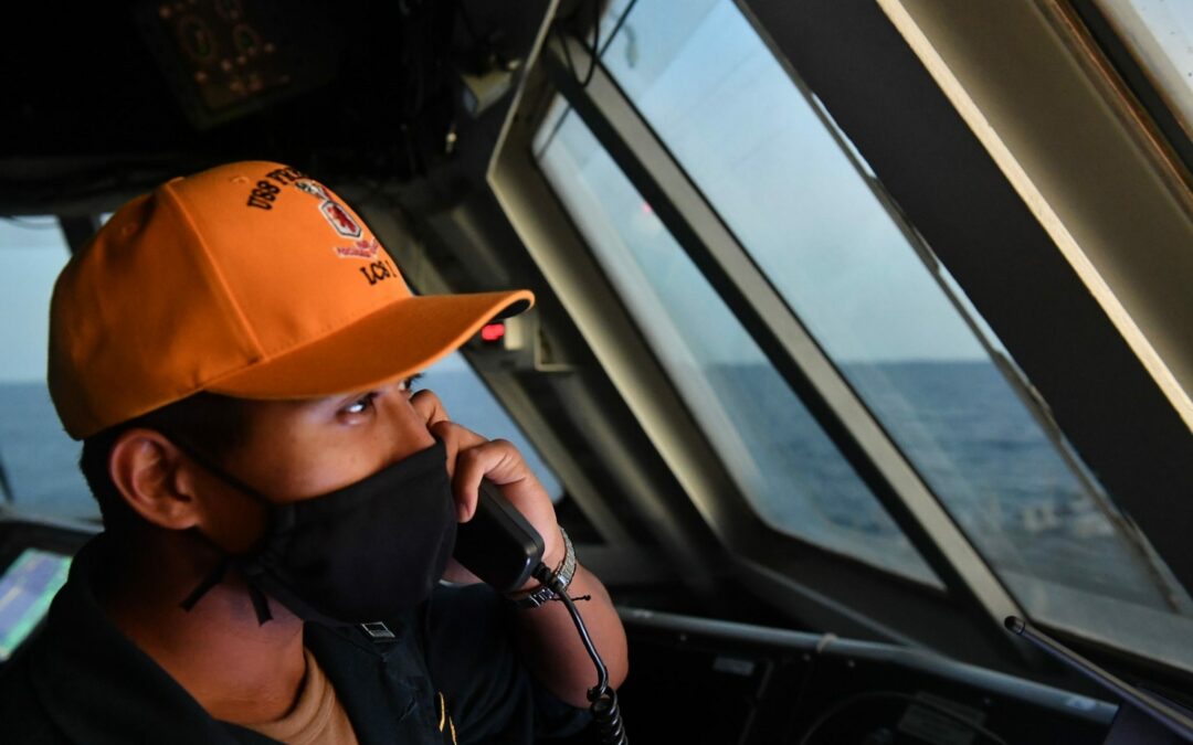 Lt. Brian Aninzo from Conroe, Texas, stands watch as the officer of the deck (OOD) aboard the Freedom-variant littoral combat ship USS Freedom (LCS 1)